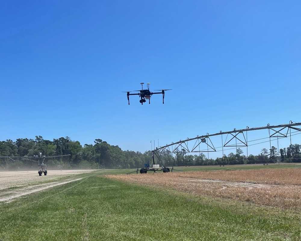 drone flying over trial